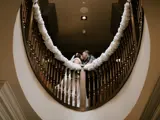 Couple kissing in the stairwell at Boclair House