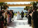 Bride and groom at an outdoor ceremony at Brisbane House in Largs, Scotland.