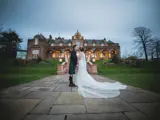 Couple kissing outside of Boclair House Hotel