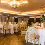 Wedding reception tables set up in the Grand Ballroom at The Redhurst, Giffnock
