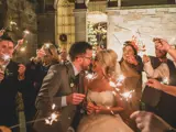 Couple kissing under sparklers