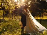 Couple kissing in a field at Cornhill Castle
