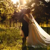 Couple kissing in a field at Cornhill Castle