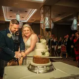 Couple cutting their cake at Boclair House