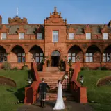 Couple walking towards Boclair House Hotel