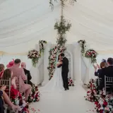 Couple kissing at the altar