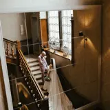 Couple sharing a moment on the stairs at Cornhill Castle