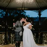 Couple sharing a kiss at the band stand