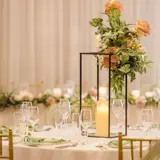 Wedding meal table floral centrepieces in the Grand Ballroom
