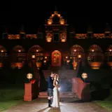 Couple outside of Boclair House at night
