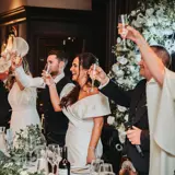 Wedding party raising a glass