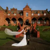 Couple standing outside of Boclair House 