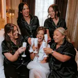Bride and Bridesmaids sharing a drink