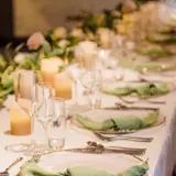 Wedding top table set up with sage coloured napkins in the Grand Ballroom at The Redhurst