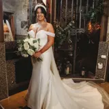 Bride posing in front of staircase