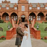 Couple sharing a moment outside Boclair House Hotel