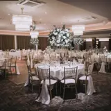 Ballroom set up for wedding with dancefloor in the middle
