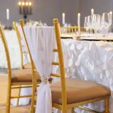 Chair with white covering and diamonds