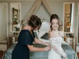 Bride and Bridesmaid getting ready in the honeymoon suite of Conrhill castle