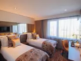 Twin room with made beds