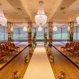 boclair house hotel wedding ceremony hall with ornate chairs and floral arrangements