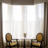 Chairs next to window