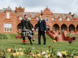 married gay couple on the boclair grounds after wedding ceremony