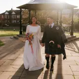 Couple walking from the band stand