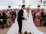 Couple kissing at the altar