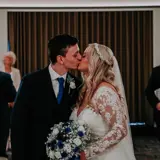 Couple Kissing as they get married