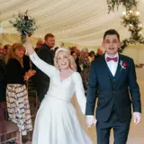 Couple just married walking down the aisle