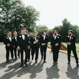 Groom and groomsmen walking