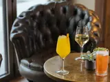 Lounge chair with cocktails on table