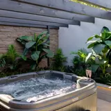 Outdoor hot tub setup at The Garden House Honeymoon Suite at Redhurst Hotel Glasgow
