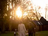 Couple walking towards lodges