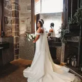 Bride posing with flowers