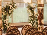 Floral displays and chairs set up in a function room in Boclair House in Glasgow