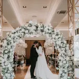 Couple kissing at the altar