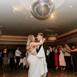 Wedding couple first dance with sparkling glitter ball