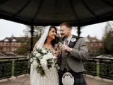 married couple in boclair house gardens toasting champagne