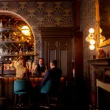 Couple sitting at the bar at Cornhill