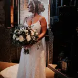 Bride posing with flowers