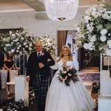 Father and Daughter walking down the aisle