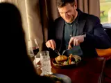 Man eating dinner at Cornhill Castle