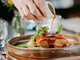 Gravy being poured onto food at the Ghillie restaurant