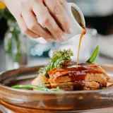 Gravy being poured onto food at the Ghillie restaurant