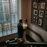 married couple at wedding in an ornate staircase at boclair house