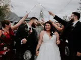 Couple walking under sparklers