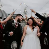 Couple walking under sparklers