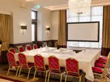 a meeting room arrangement with presentation board